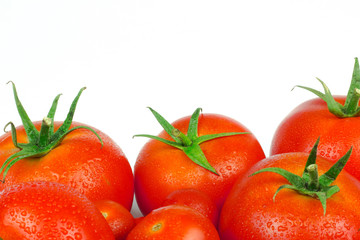 Tomatoes. Whole and a half isolated on white