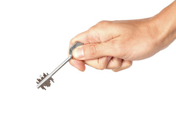 Metal key in the human hand, isolated on the white