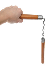 Nunchaku in a hand to isolate on the white