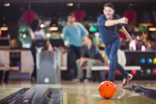 bowling ball is rolling towards the pins