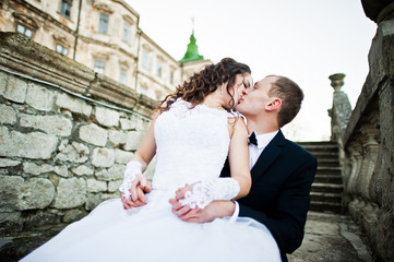 Charming and fashionable wedding couple in love background old v