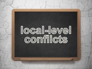 Political concept: Local-level Conflicts on chalkboard background