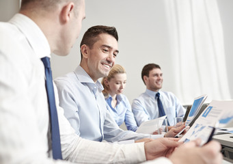 smiling business people meeting in office