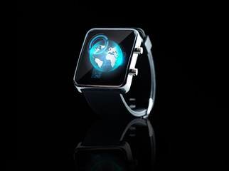 close up of smart watch with earth globe