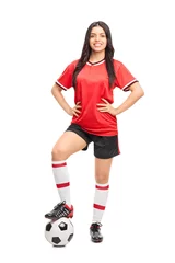 Foto op Plexiglas Female football player in a red jersey © Ljupco Smokovski