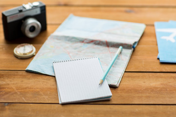 close up of notepad with map and travel tickets