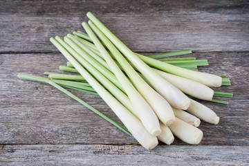 Fresh lemongrass (citronella) on wooden background - Spice for h