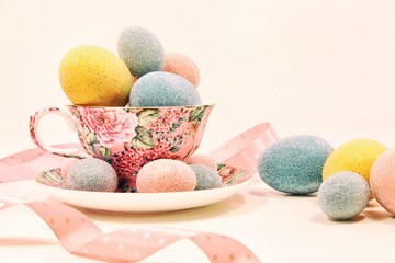 Decorative easter eggs in china cup