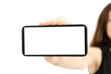 Woman showing smart phone with copy space