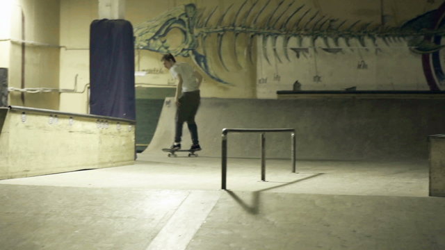 Skateboarder slide on the rails