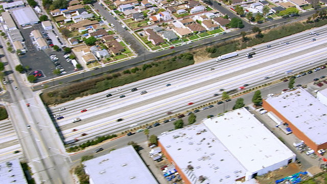 Aerial time-lapse shot of cars driving on freeway