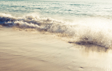 Wave of the sea on the sand beach