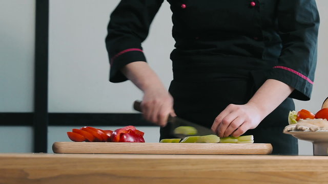 Professional chef chopping celery