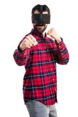Man using VR glasses giving a punch