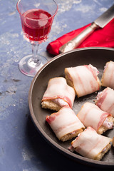 Rich snack of bacon and bread stuffed with cheese