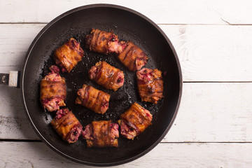 Rich snack of bacon and bread stuffed with cheese