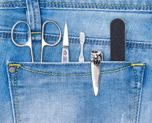 Basic set of manicure tools in jeans pocket