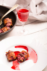 Rich snack of bacon and bread stuffed with cheese