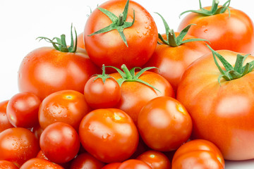 Tomatoes. Whole and a half isolated on white