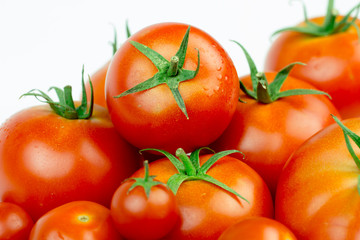 Tomatoes. Whole and a half isolated on white