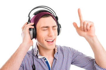 man in cap and headphones listening music and gesturing with rai