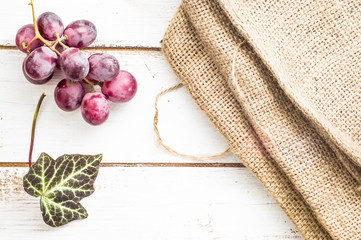 Bunch of grapes on a wooden background