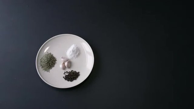 Flat Plate With Spices on Black Table