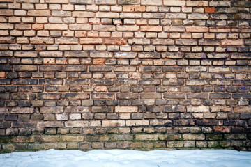 Yellow brick wall and snow