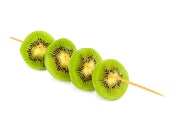 Slices of kiwi fruit on a wooden stick.