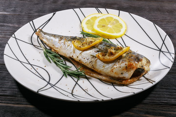 Grilled mackerel fish with lemon and rosemary