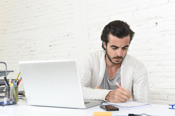 student preparing university project or hipster style freelancer businessman working with laptop