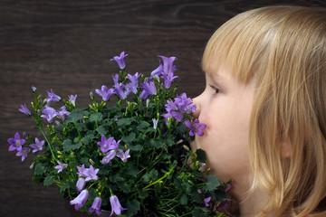 Little girl with a bouquet of wild flowers - wild bells 