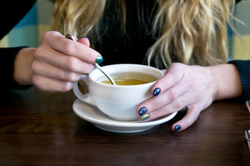 Woman drink tea in a cafe