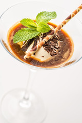 exclusive coffee dessert with ice cream in martini glass and mint leaf on white background, product photography for restaurant