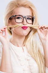 A portrait of beautiful blonde girl wearing glasses
