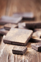 Dark chocolate on the wooden table