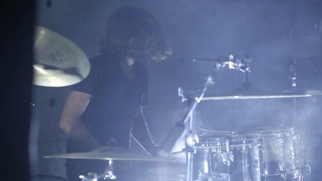 drummer playing drums, slow motion