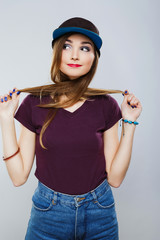 Funny girl with red lips wearing shirt at gray background