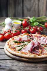 Italian pizza with ham and asparagus