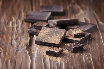Dark chocolate on the wooden table