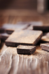 Dark chocolate on the wooden table