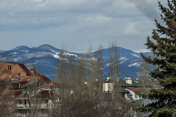 Fototapeta na wymiar Vitosha mountain in winter and part of residential quarter, Sofia, Bulgaria 