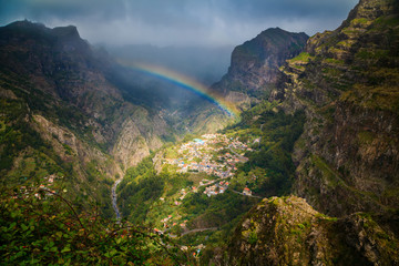 rainbow above mountain village - obrazy, fototapety, plakaty