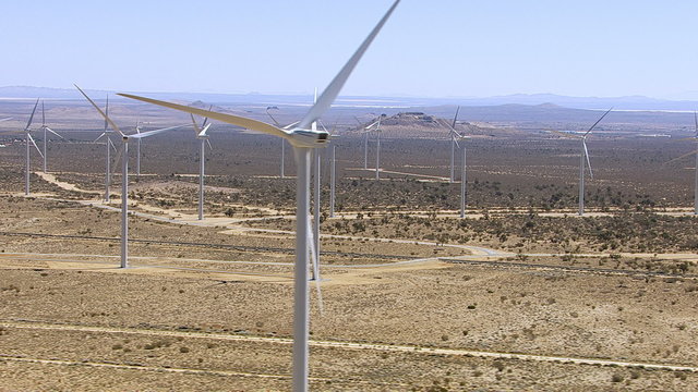 Aerial shot of energy producing wind turbines