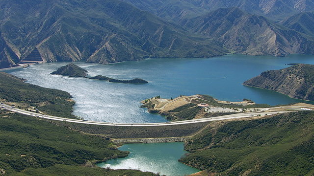 Aerial shot of lake with highway bridge