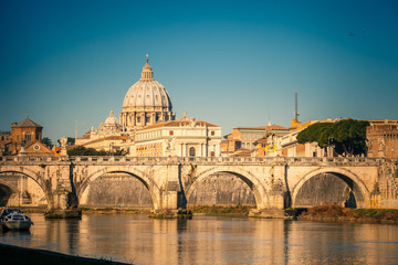 Fototapeta na wymiar View at Tiber and St. Peter's cathedral in Rome