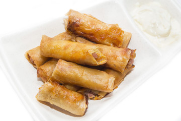 fried rolls with garlic sauce on a white background