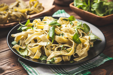 Cooked tagliatelle on a plate - 105368852