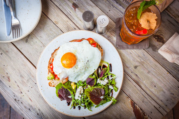 Salad with fried egg and apple tea