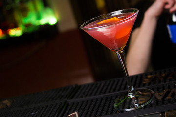 red cocktail on bar